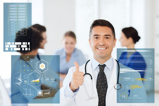 happy doctor showing thumbs up at hospital